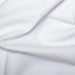 Close-up of white fabric with folds