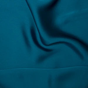 Teal fabric with a smooth texture