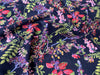 Navy blue fabric with colorful floral pattern