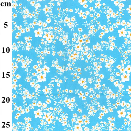 Floral pattern on a blue background with measurement scale
