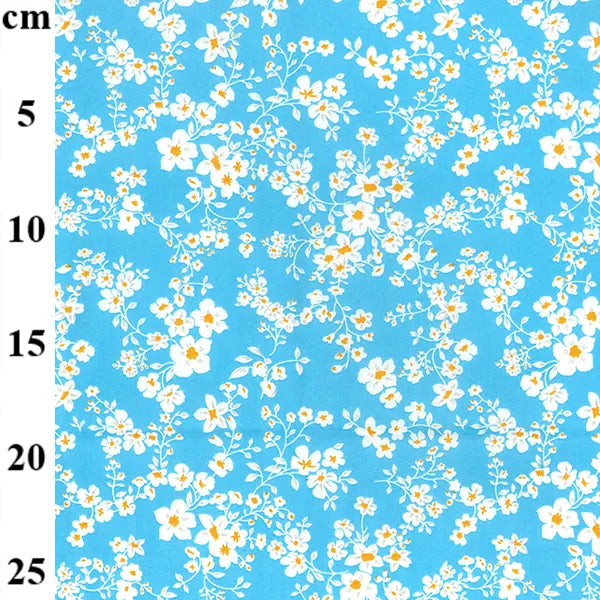 Floral pattern on a blue background with measurement scale