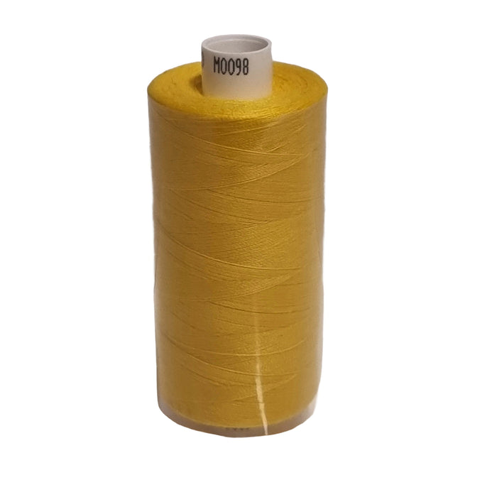 Large spool of yellow thread on a white background