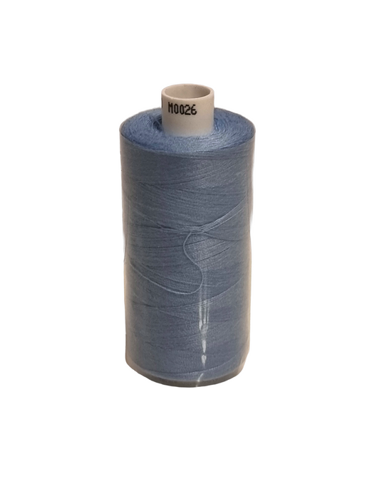 Spool of blue thread on a white background