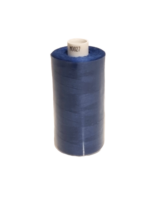 Spool of blue thread on a white background