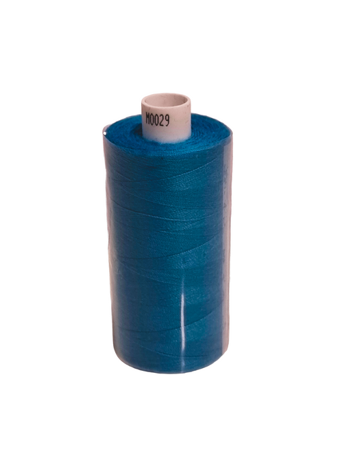 Blue spool of thread on a white background