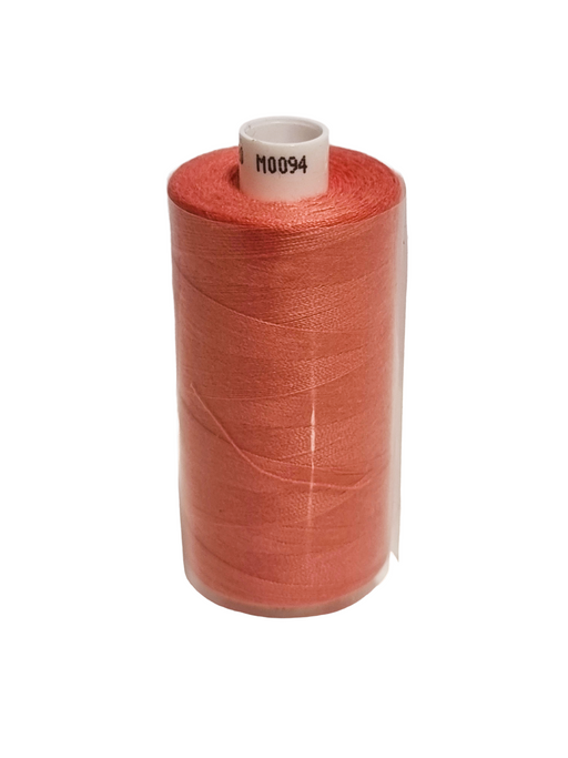 Spool of red thread on a white background