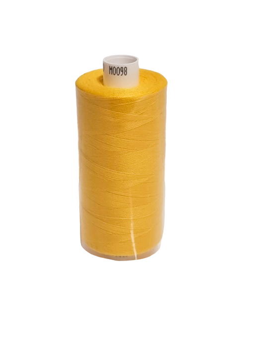 Spool of yellow thread on a white background