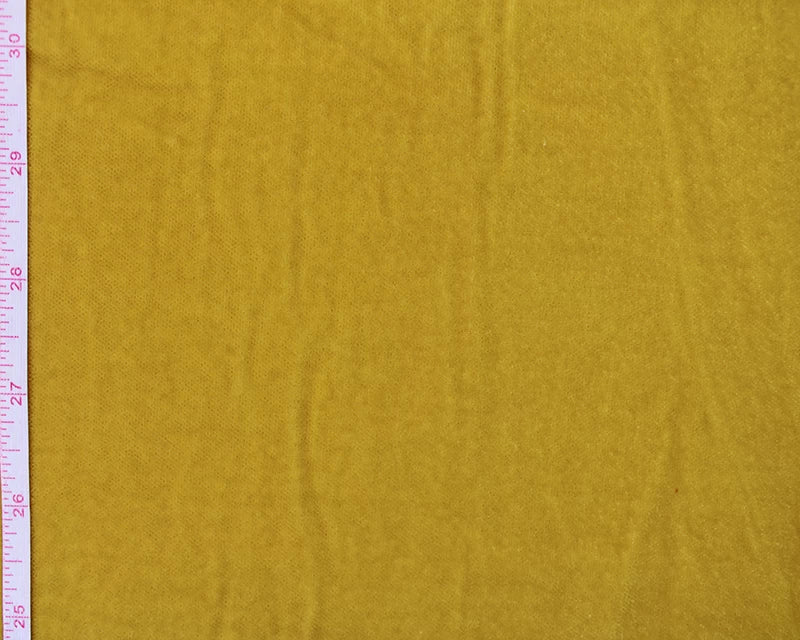 Yellow fabric with a ruler on the left side for scale