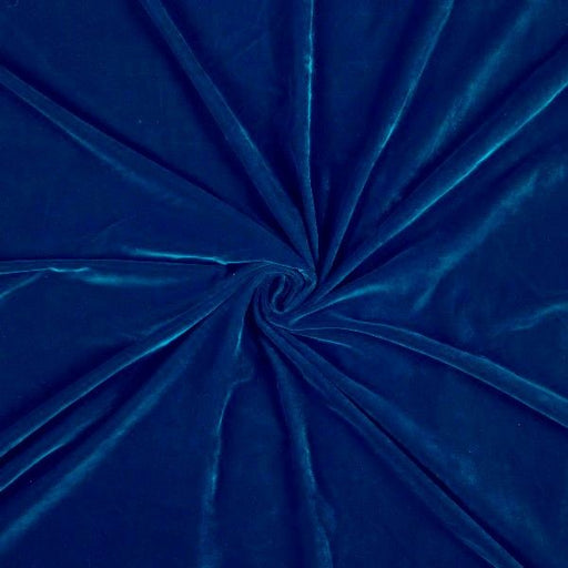 Close-up of blue velvet fabric with a swirl pattern