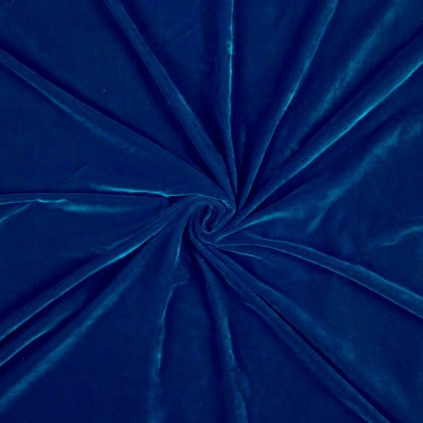 Close-up of blue velvet fabric with a swirl pattern