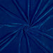 Close-up of blue velvet fabric with a swirl pattern