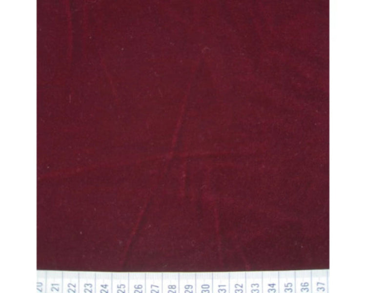 Burgundy fabric swatch with a ruler at the bottom for scale.