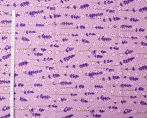 Fabric with lavender pattern on a purple background