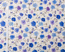 Floral pattern with blue and purple flowers on a white background