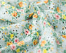 Floral fabric with colorful flowers on a light blue background