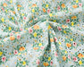 Floral fabric with small flowers on a light green background