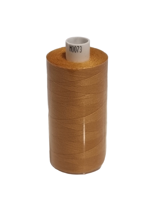 Spool of brown thread on a white background