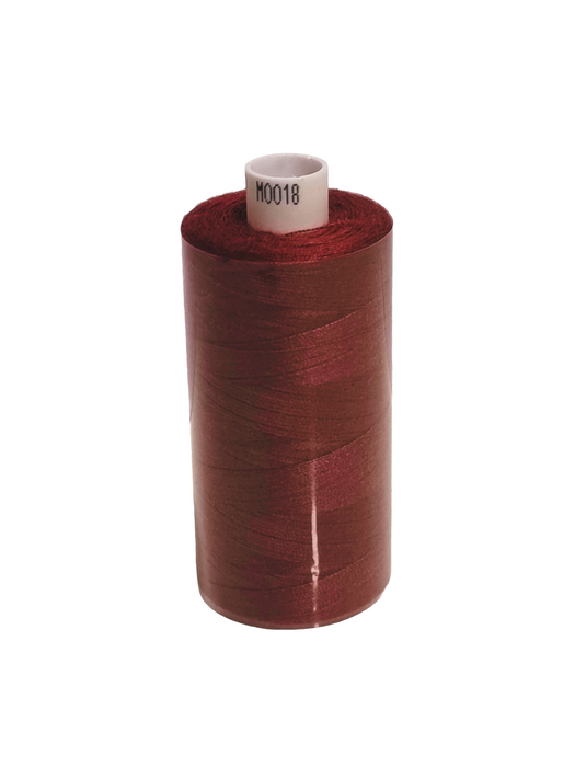 Spool of red thread on a white background