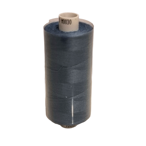 Spool of blue thread on a white background