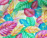 Colorful tropical leaf pattern on a fabric background