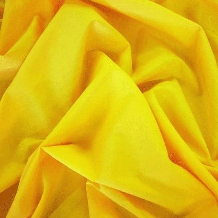 Flo yellow plain polycotton fabric