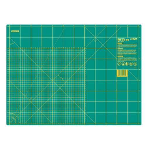 Green cutting mat with grid lines on a white background